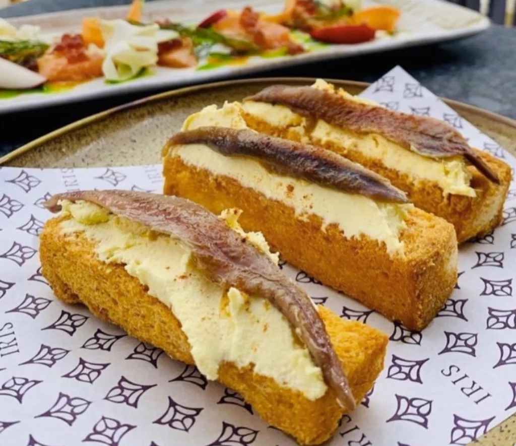 Anchovies on Tomato Migas Bread, Spain