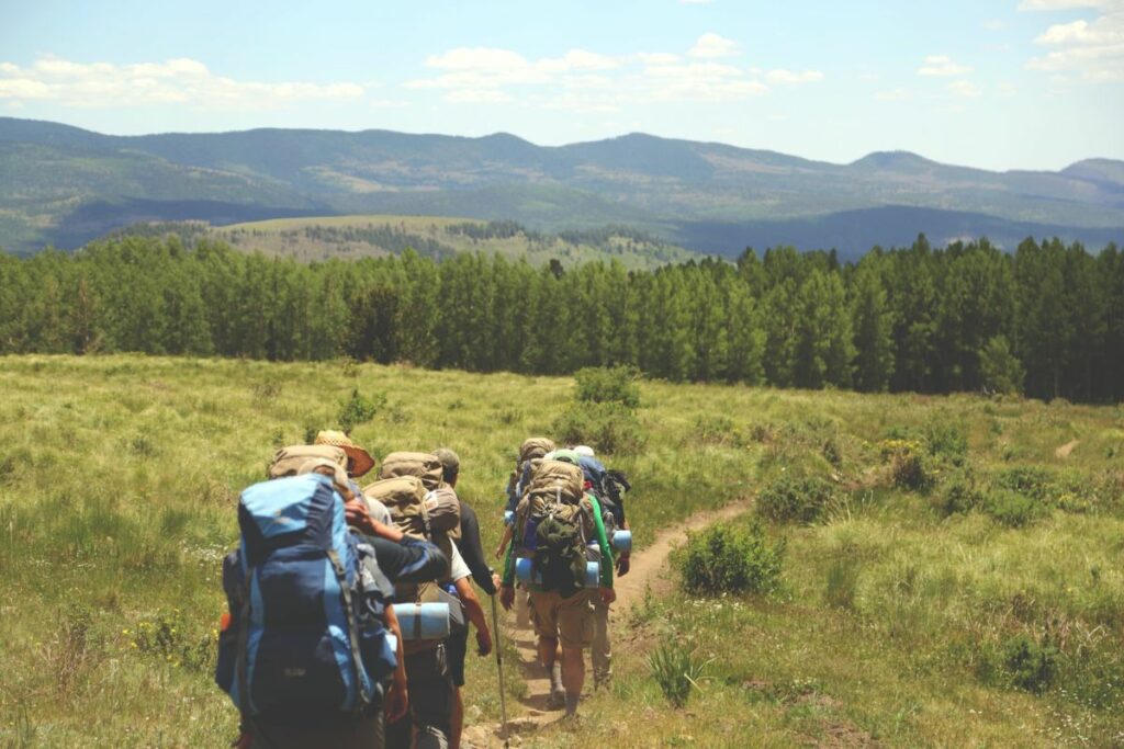 Backpackers following a dirt trail