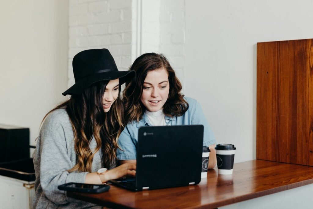 Two ladies browsing on computer